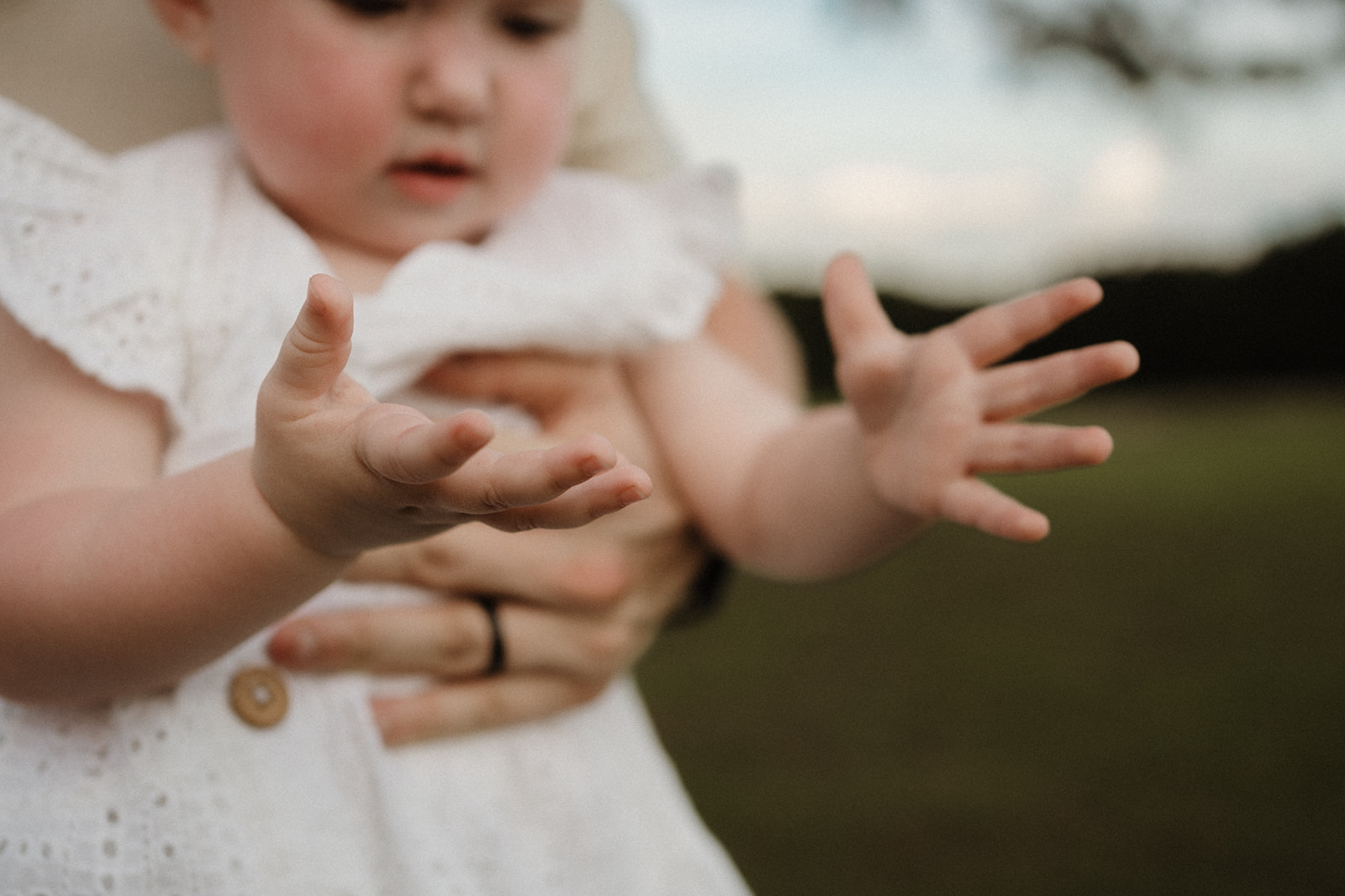 closeup of little girls hands as she looks at them